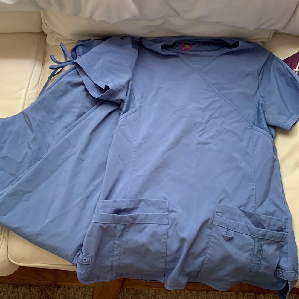 Two pairs of ceil blue scrubs